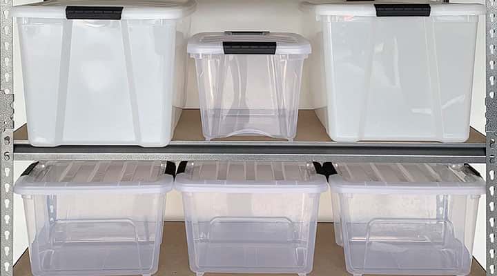 clear empty plastic storage bins in a variety of sizes stack away on shelves